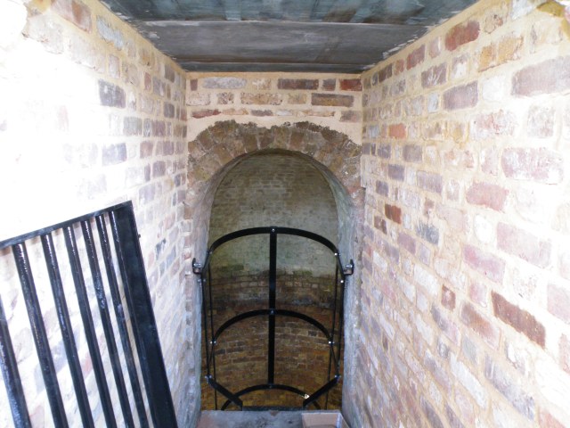 Photo of brick-lined entrance passage to the ice house.